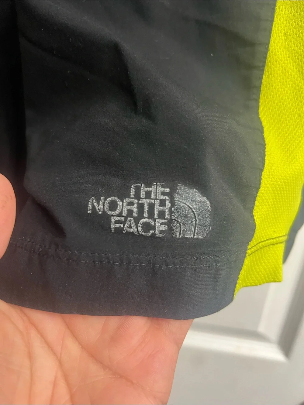 The North Face Men's Black Swim Shorts with Neon Yellow Side Panels
